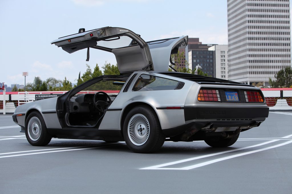 Delorean car parked outside with the doors open