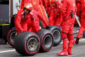 F1 crew rolling the wheels