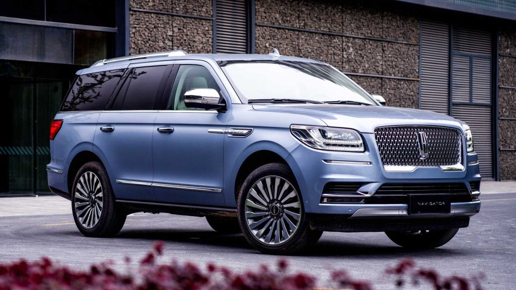 Lincoln Navigator parked in fornt of the house.