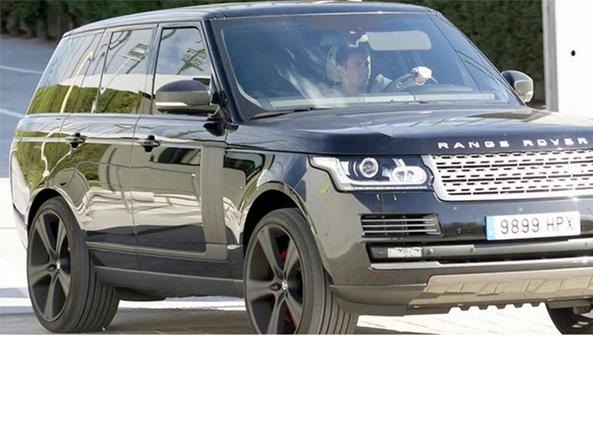 Leo Messi driving a Range Rover.